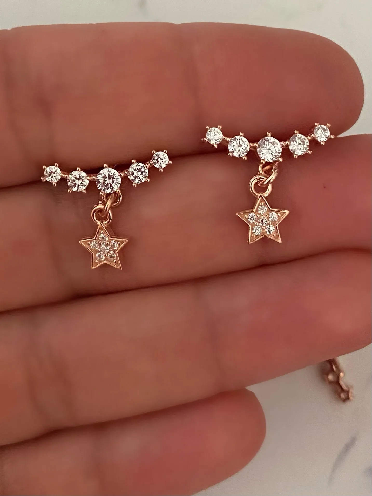 Arch earrings with charms