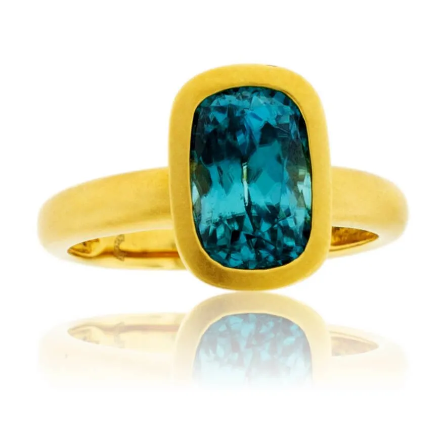 Bezel Set Modified Cushion-Cut Blue Zircon Yellow Gold Ring