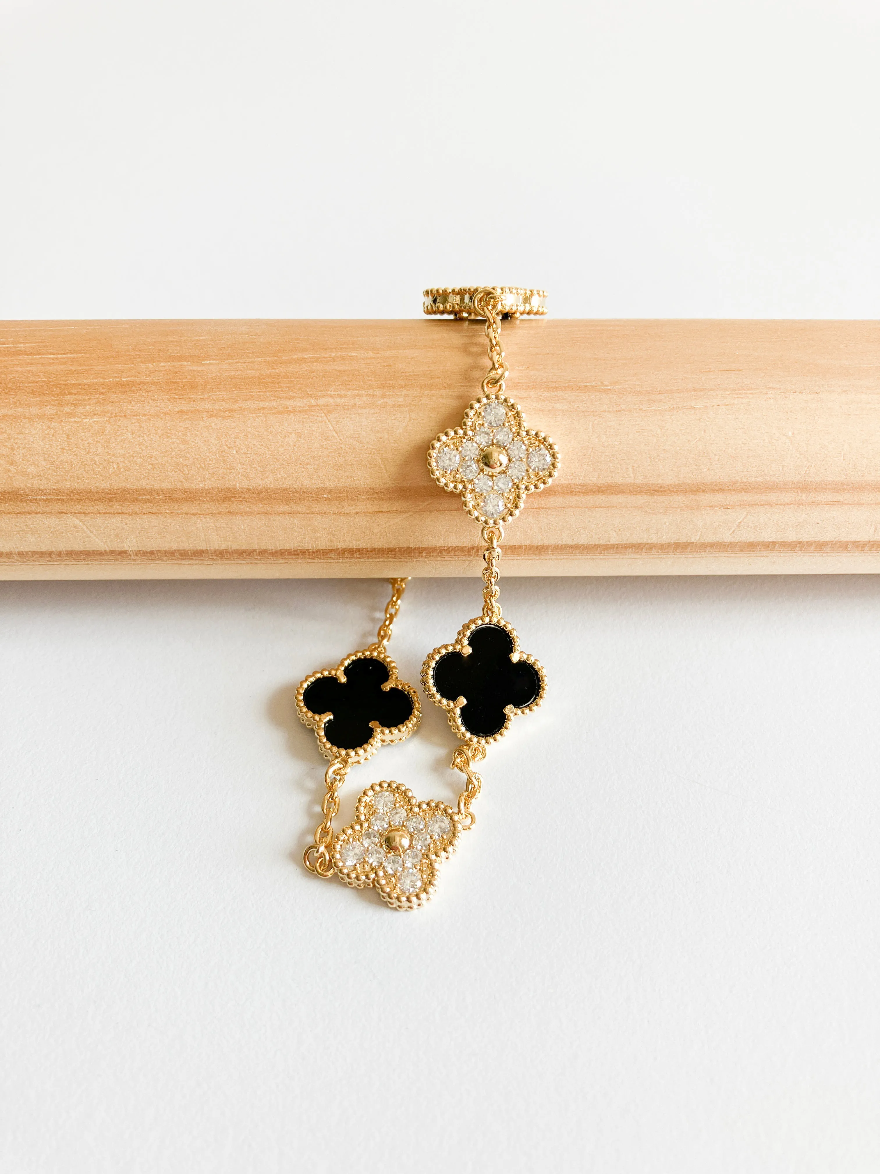 Cubic Zirconia and Onyx Demi Quatrefoil Bracelet in Gold