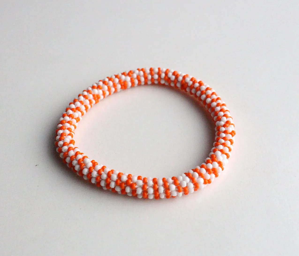 Jazzy Orange Roll Beads Bracelet