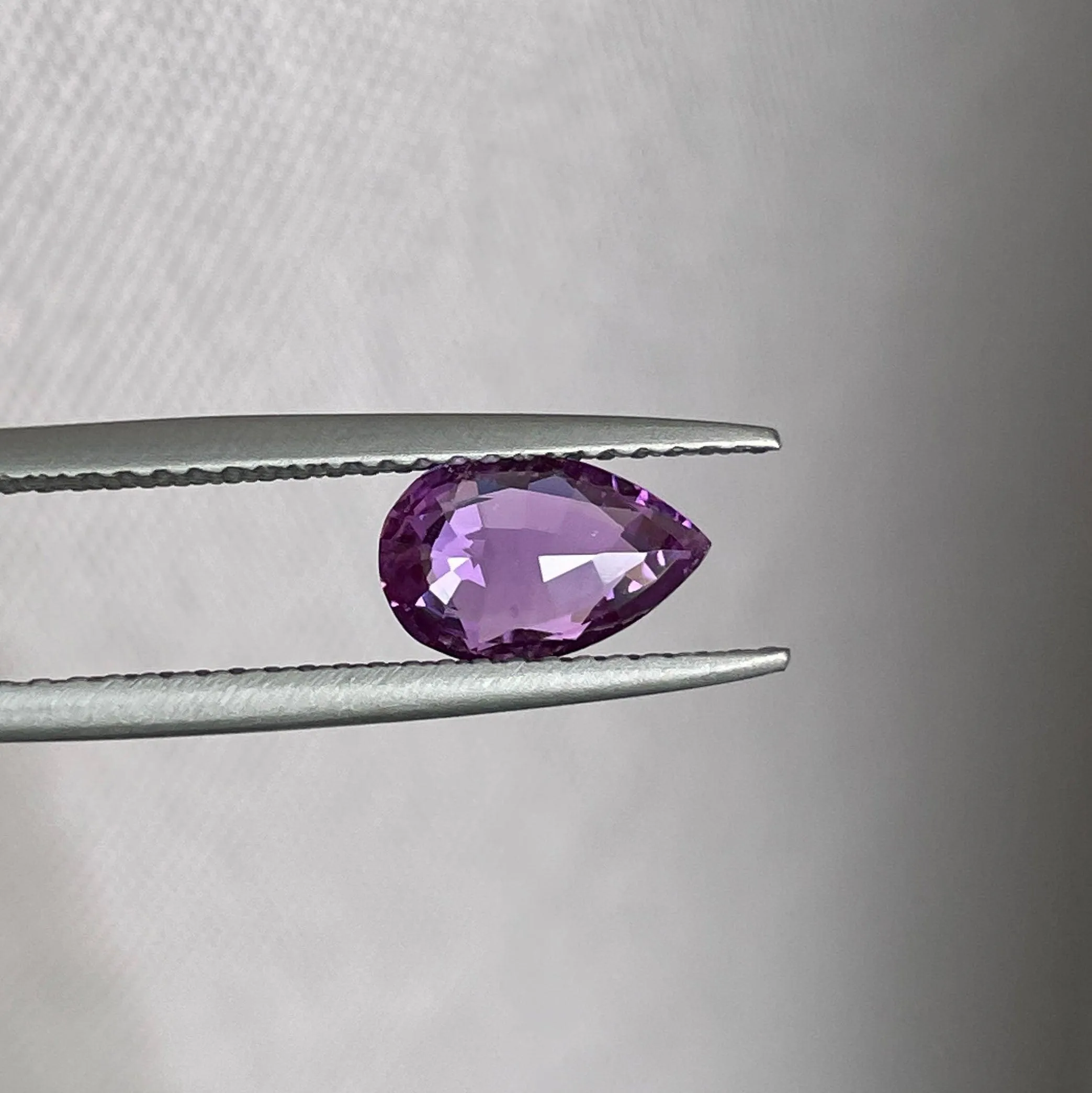 loose purple sapphire 1.08 crt purple pink sapphire online,  selling loose gemstones online for october birthstone jewelry as fiance ring, made to order engagement rings in new world gems selling loose gemstones online