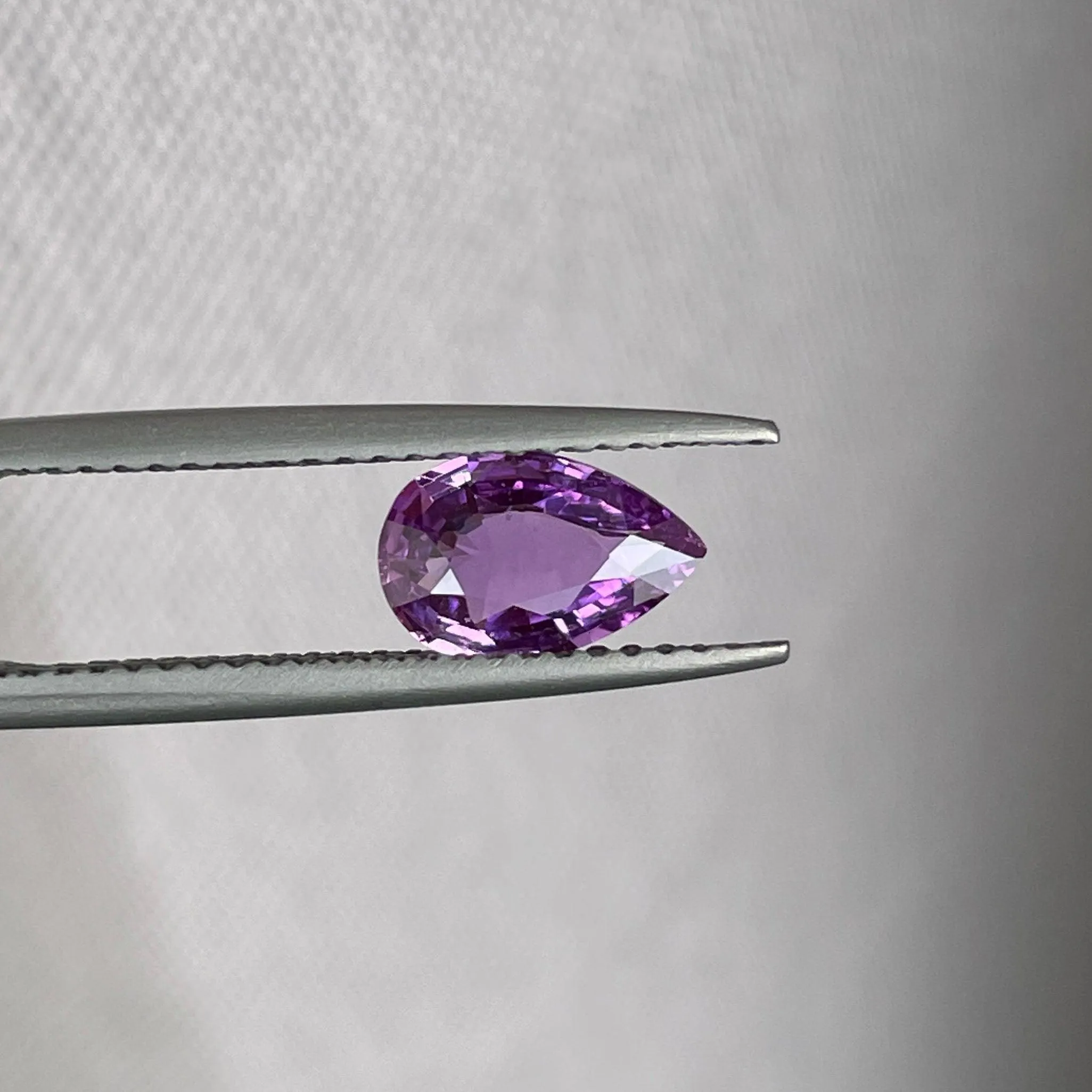 loose purple sapphire 1.08 crt purple pink sapphire online,  selling loose gemstones online for october birthstone jewelry as fiance ring, made to order engagement rings in new world gems selling loose gemstones online