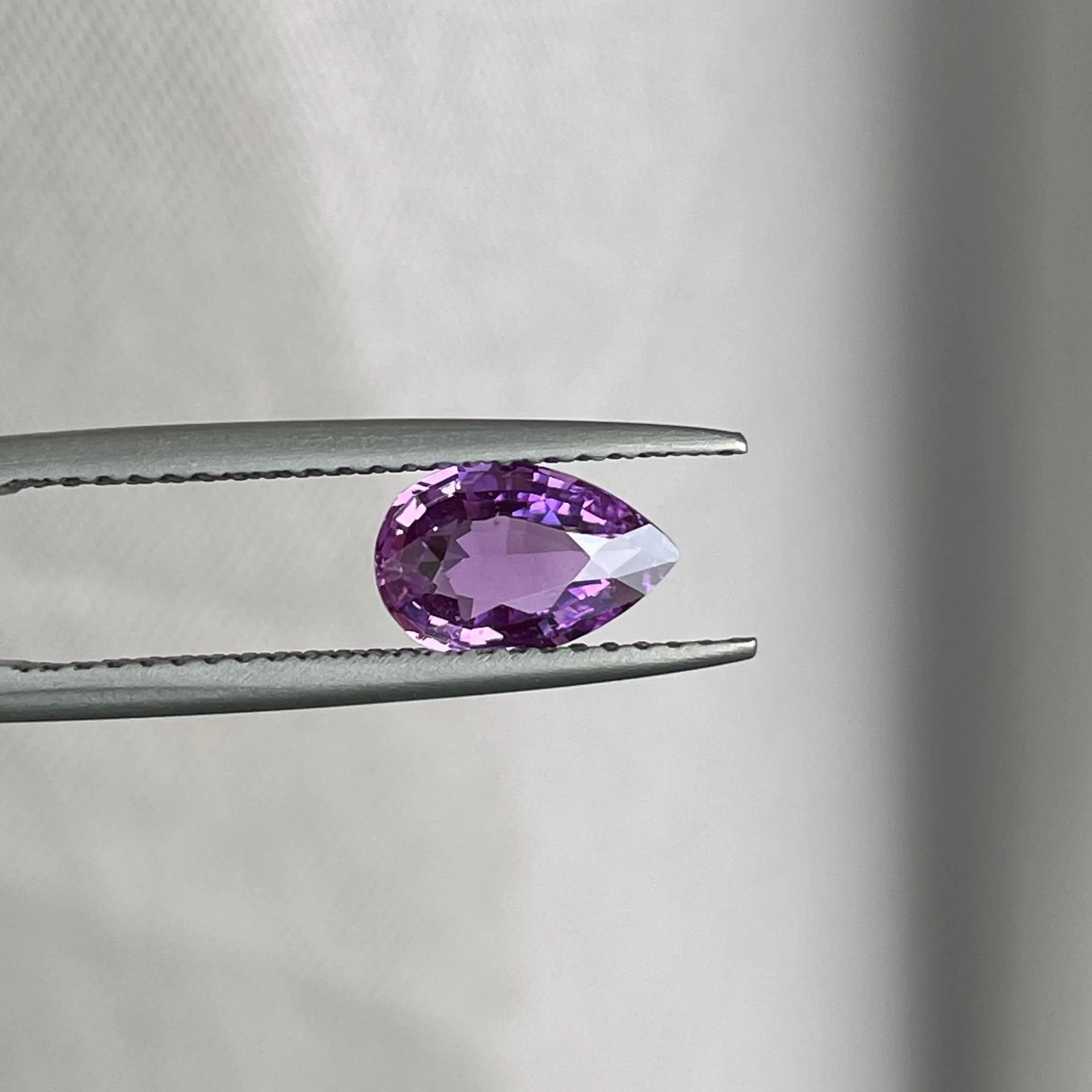 loose purple sapphire 1.08 crt purple pink sapphire online,  selling loose gemstones online for october birthstone jewelry as fiance ring, made to order engagement rings in new world gems selling loose gemstones online