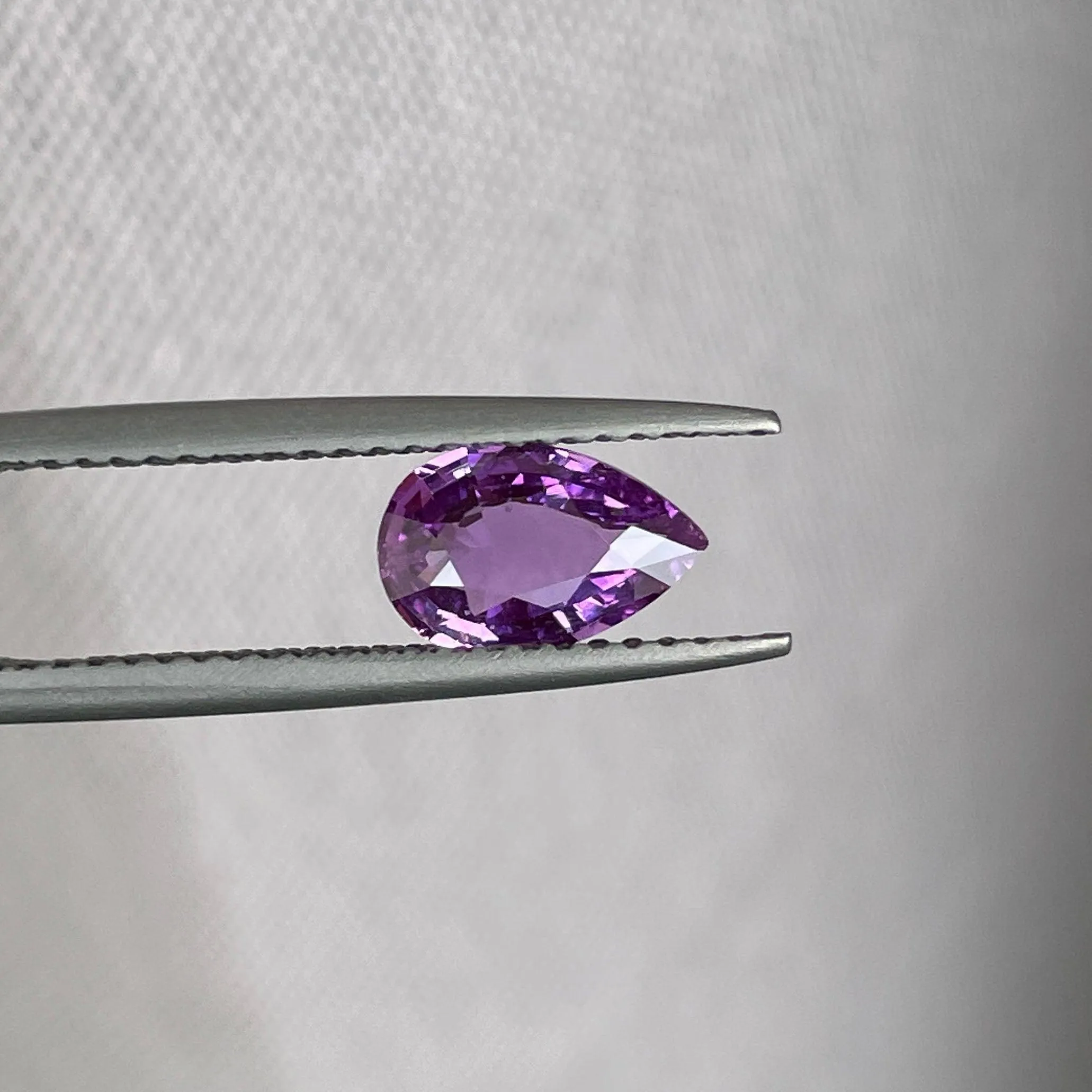 loose purple sapphire 1.08 crt purple pink sapphire online,  selling loose gemstones online for october birthstone jewelry as fiance ring, made to order engagement rings in new world gems selling loose gemstones online