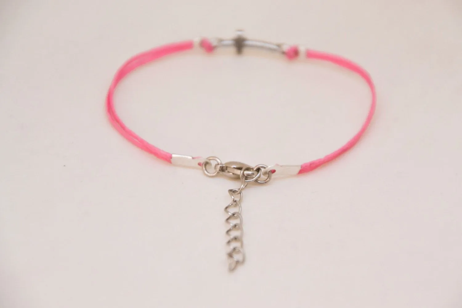 Women bracelet with silver cross charm and pink cord, Christian gift for her