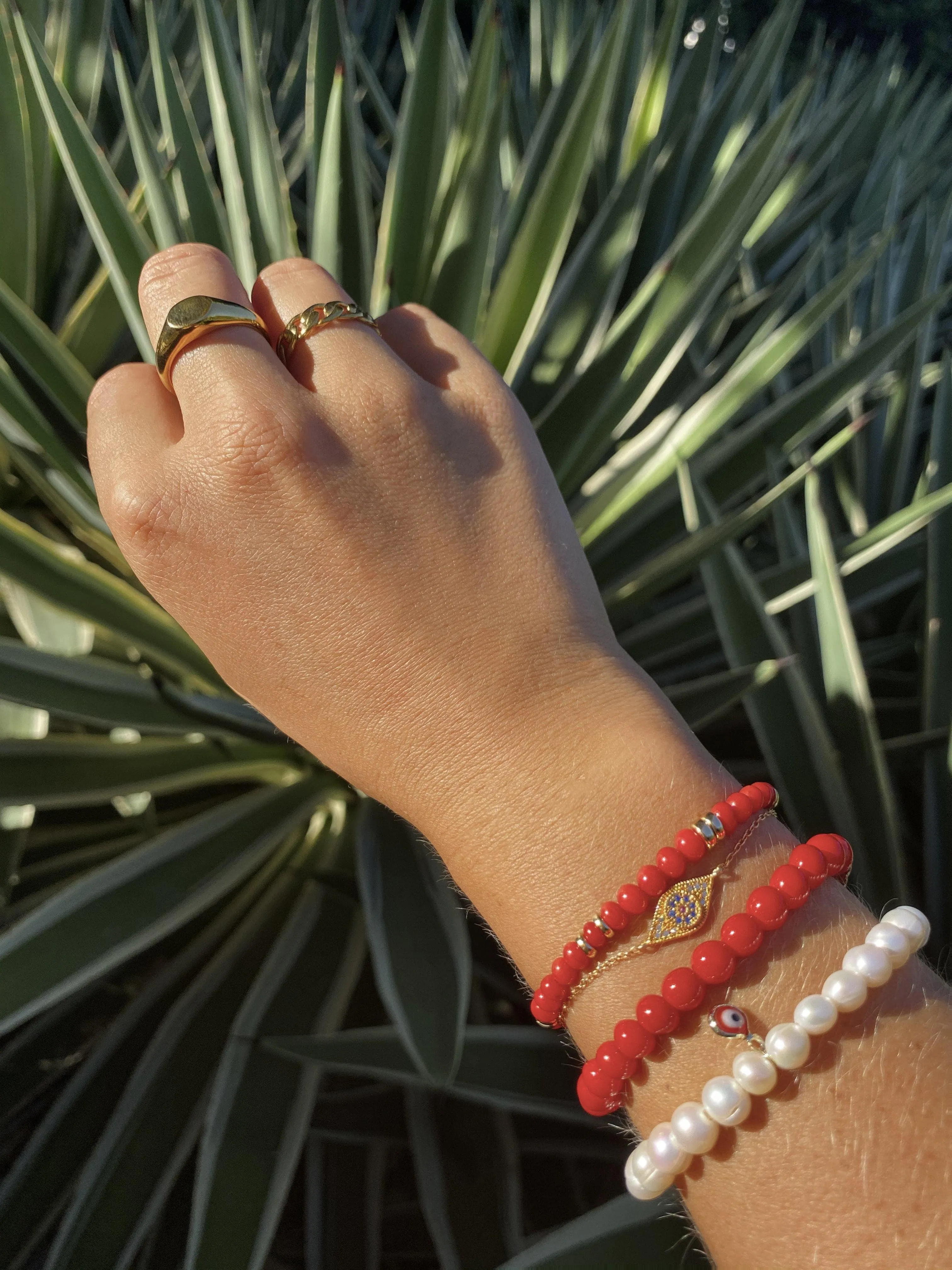 Wristband with White Pearls and Red Evil Eye Charm